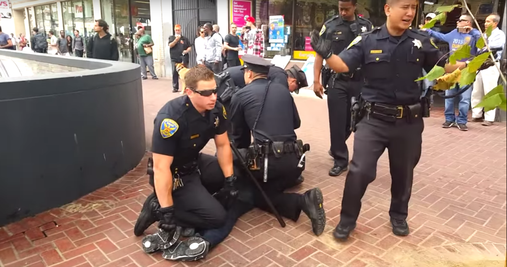 SFPD officers were criticized for a scuffle with a disabled man while attempting to handcuff him.<br>Image courtesy of footage provided by Chaédria LaBouvier.