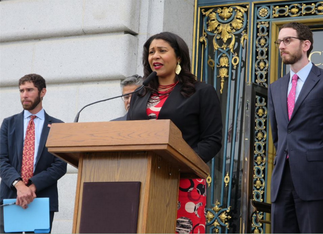 Board of Supervisors President London Breed speaks in front of City Hall