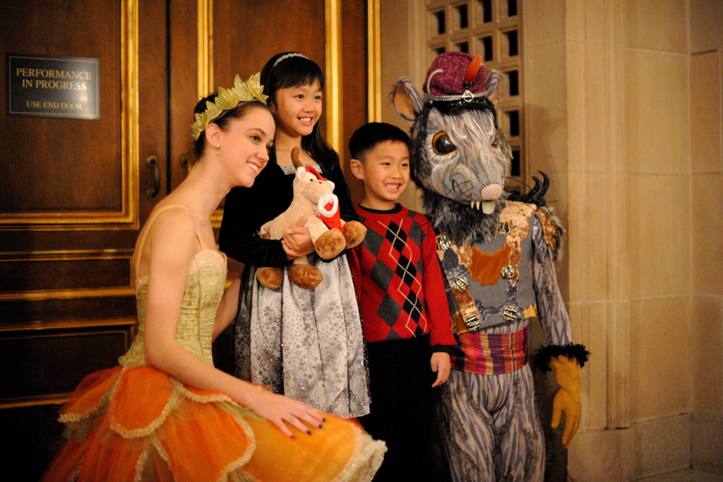 A photo taken with two cast members before the showing of Nutcracker on a family performance night. 