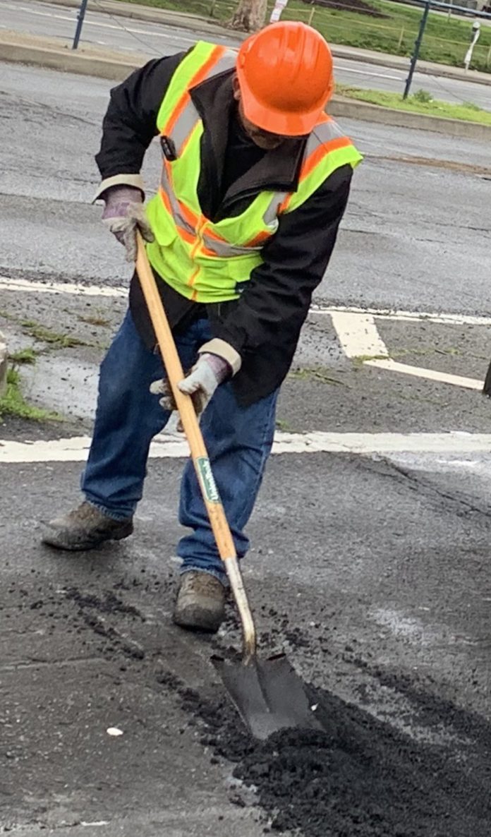 Crew Repairs Potholes After Soggy Weather