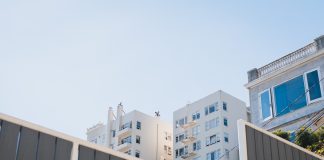 Landlord Threatens Suit Over Apartment Buildings