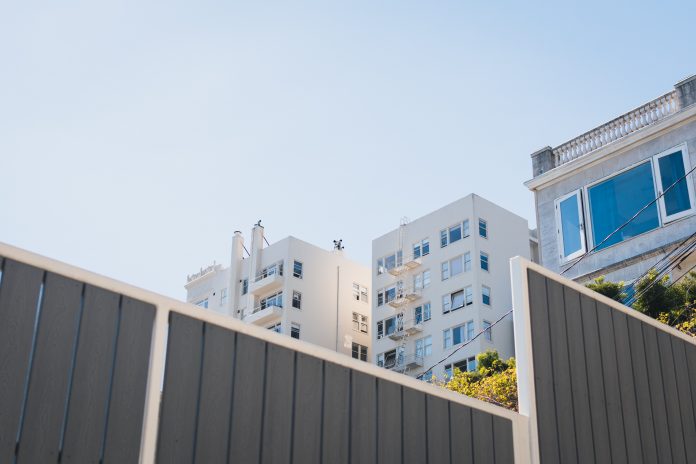 Landlord Threatens Suit Over Apartment Buildings