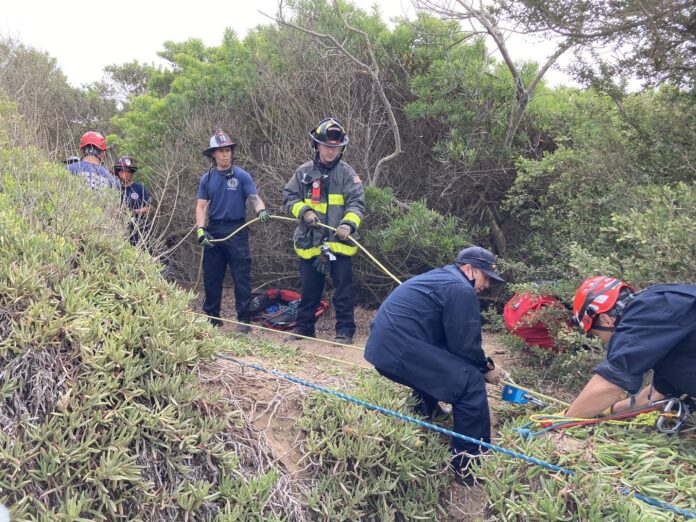 Father And Son Rescued From Cliff