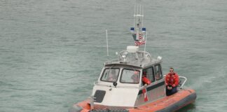 Three People Rescued After Boat Capsizes In Bay