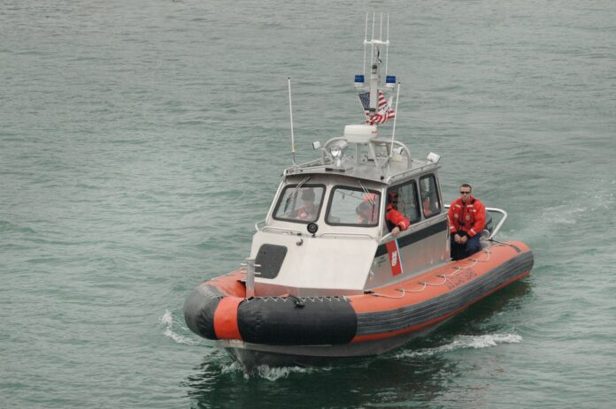 Three People Rescued After Boat Capsizes In Bay