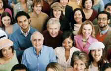 Studio Shot of a Large Mixed Age, Multiethnic Group of Smiling Men and Women