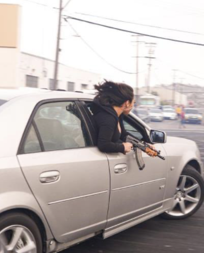 Passenger In Cadillac Seen Holding An AK-47
