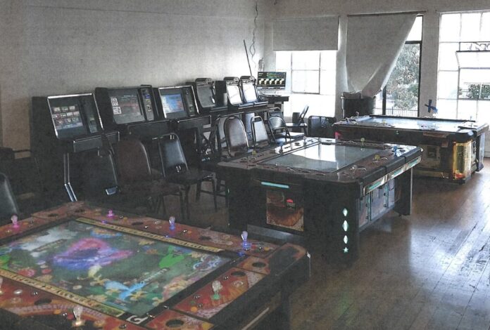 Gambling Machines, Guns & Narcotics Seized During Illegal Gambling Den