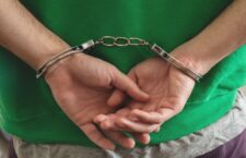 Arrest,,Handcuffed,Criminal,Man,Hands,Close,Up.,Hand,Cuffs,Locked